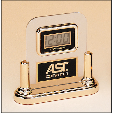 Acrylic clock with LCD movement on a gold base.