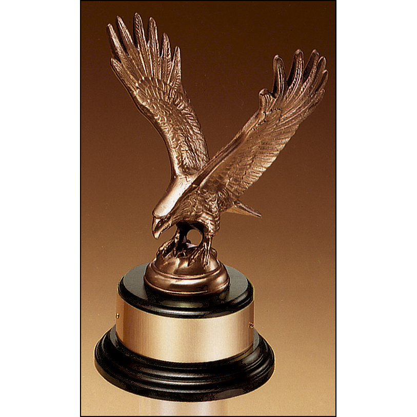 Fully modeled antique bronze eagle casting on a black wood base.
