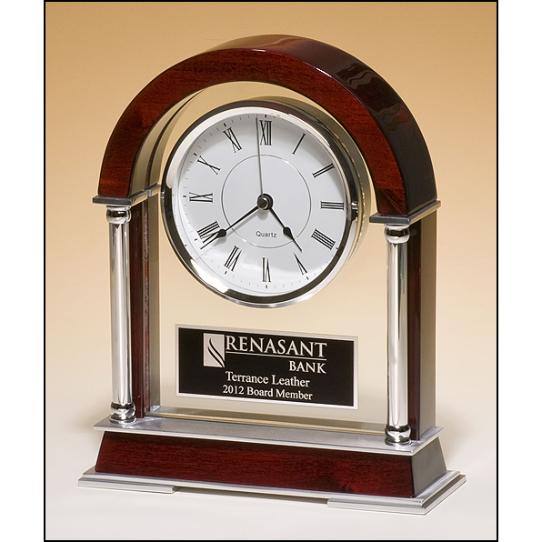 Mantle clock with rosewood piano-finish wood, chrome-plated posts and brushed silver aluminum accents.