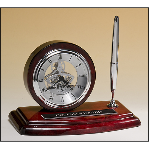Skeleton clock, silver movement and pen with rosewood piano-finish case.