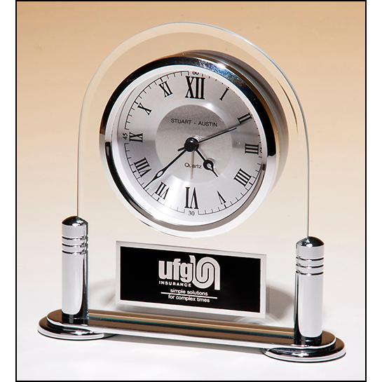 Desk clock with beveled glass upright and silver metal base, three hand clock movement.