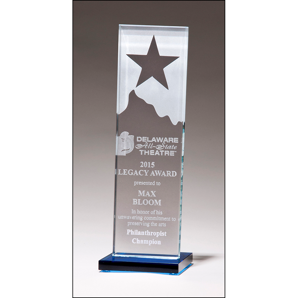 Etched clear glass award with star and mountain peak with blue glass base.