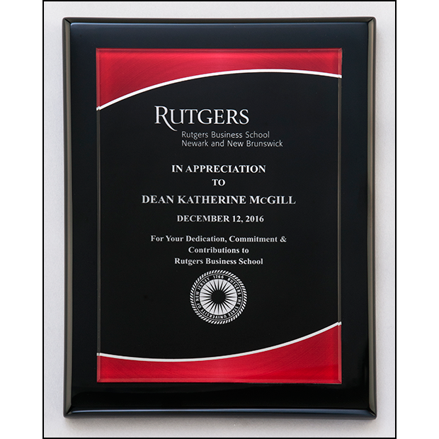 Acrylic plate with red border on black piano-finish plaque.