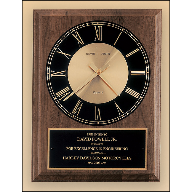 American walnut vertical wall clock with round face.