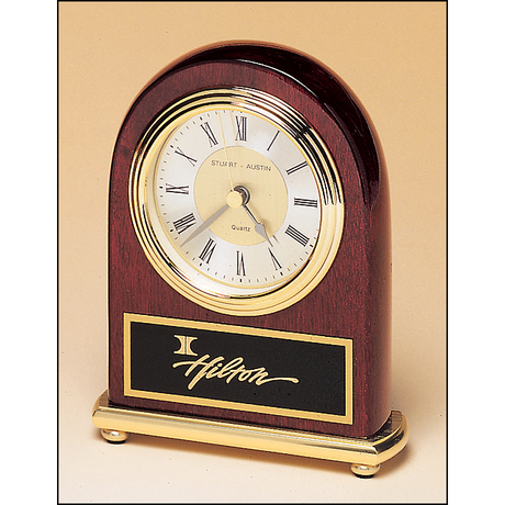 Rosewood stained piano finish clock on a brass base.