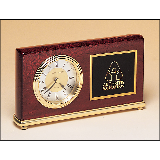 Rosewood stained piano finish clock on a brass base.