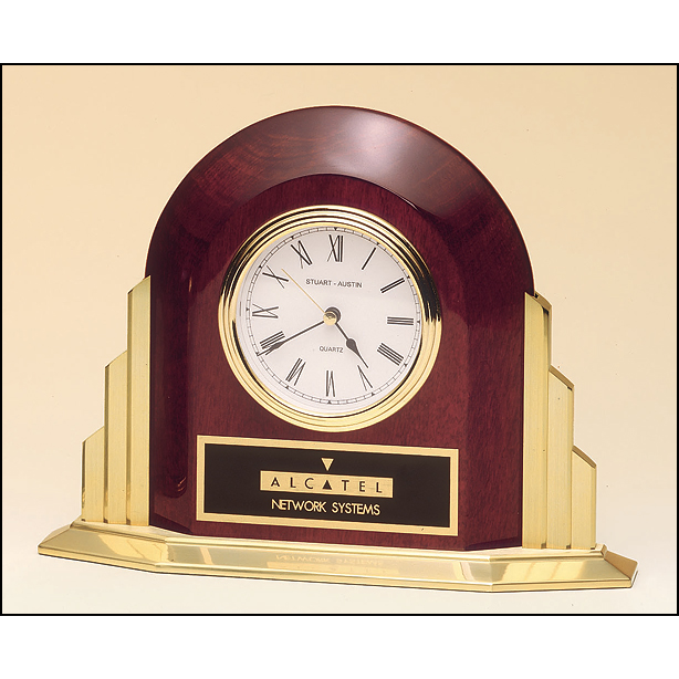 Rosewood stained piano finish desk clock with towering gold base.