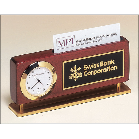 Rosewood stained piano finish combination clock and business card holder with gold metal accents.