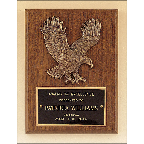American walnut plaque with a sculptured relief eagle casting.