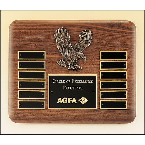 American walnut perpetual plaque with 12 black brass plates and a sculptured relief eagle casting.