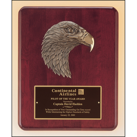 Rosewood stained piano finish plaque with antique bronze finish finely detailed eagle casting.