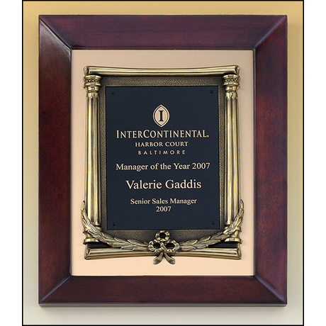 Cherry finish frame plaque with antique bronze finished frame on brushed metal gold background.
